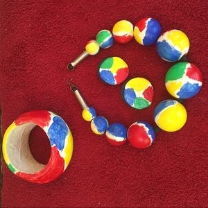 Paper-mâché necklace, bracelet, and earrings.